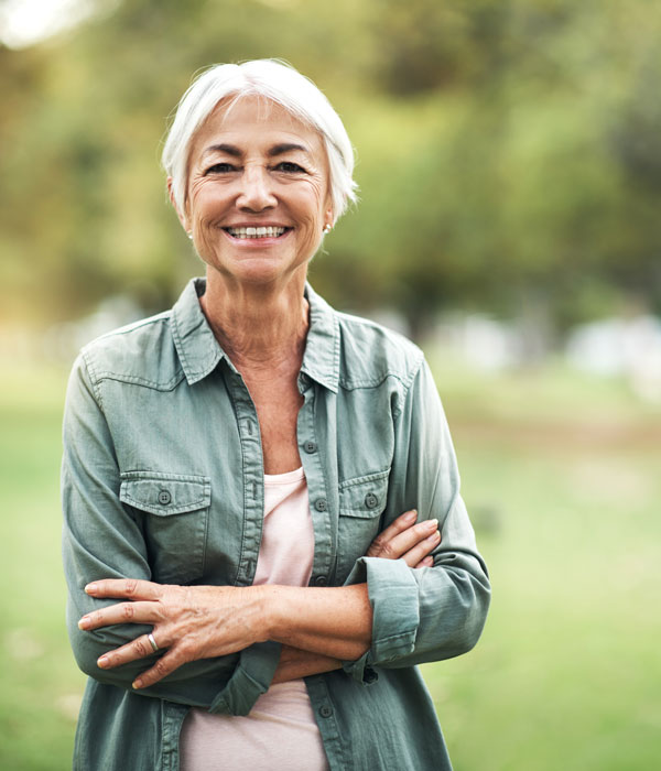 happy woman standing outside